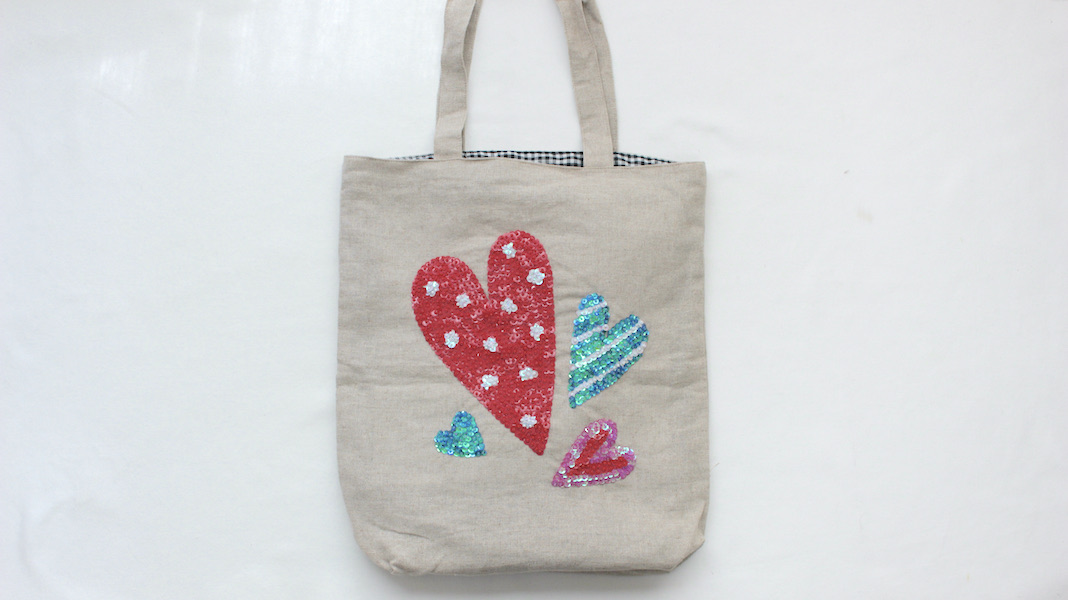 WRAPPED HEART LOGO刺繍 スパンコールバッグ-